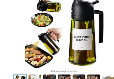 a bottle of olive oil being poured into a pitcher