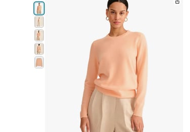 a woman in a pink sweater and pants with a pink sweater
