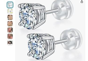 a pair of diamond studded earrings with a diamond set in the middle