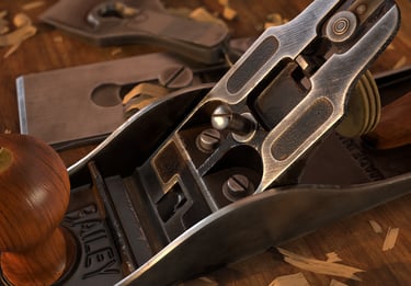 3D rendering of Stanley No. 4 wood planer surrounded by wood chips on a work bench.