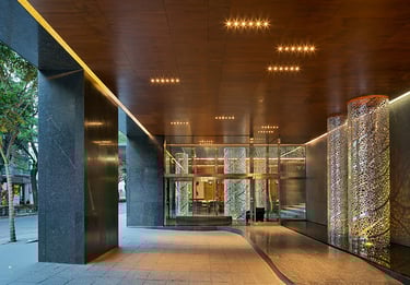 a large building with a long hallway and a large glass door