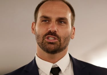 a man in a suit and tie with a black tie