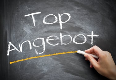 a person writing an angel foot on a chalkboard
