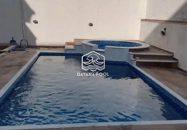 kolam renang dengan konsep bali dengan finishing batu alam