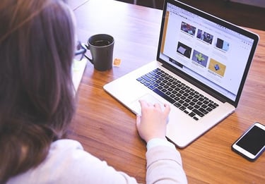 Woman doing websites on her laptop