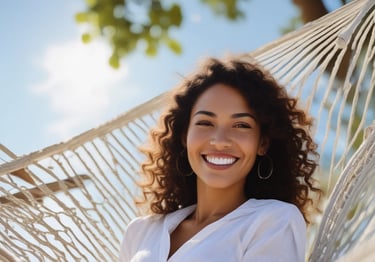 woman in blue crew-neck T-shirt laying on black hammock