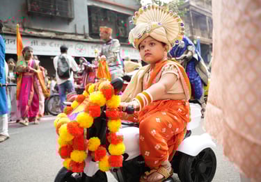 girl kid in maharastrian traditional outfit riding a motorbike in girgaon gudipadwa shobhayatra 2025