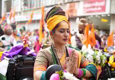 woman with dreadlocks hair riding a motorbike in girgaon gudipadwa shobhayatra 2025