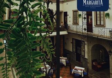 a restaurant with tables and chairs and a sign that says margarita margarita