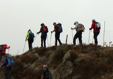 eight day-hikers on a ridgeline
