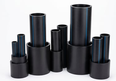 Various sizes of black HDPE water pipes with blue stripes for industrial plumbing systems.