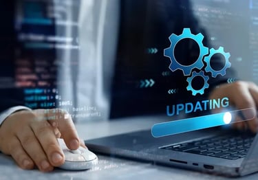 Software developer updating system software with digital gear icons and progress bar overlay.