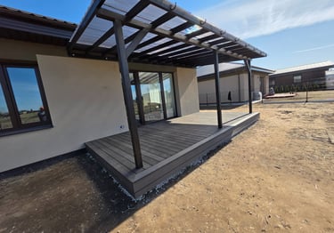a house with a deck and a covered patio