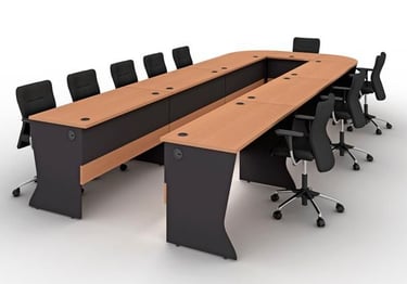 U-shaped conference room table with wood top and black ergonomic office chairs.