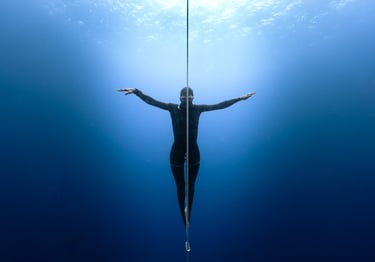 ethereal apnea athlete portrait underwater natural light by Laura Mommicchi