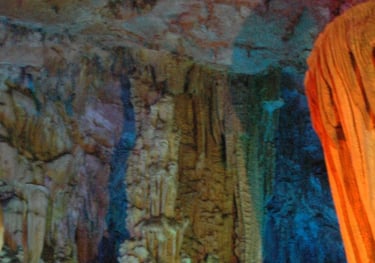 Tracey Billington at the colourful Reed Flute Caves, Guilin, China