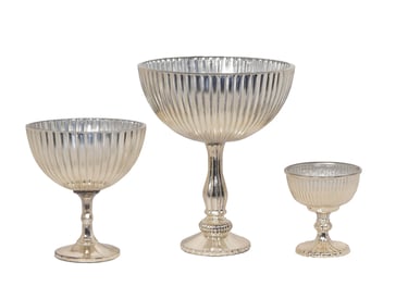a silver plated glass bowl with a silverware and a silverware pedestal