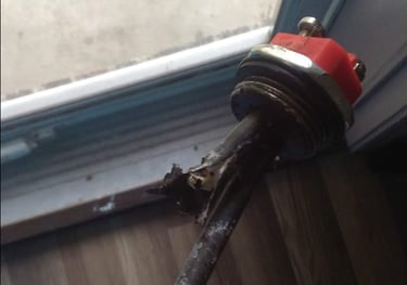 a person holding a small piece of metal in their hand