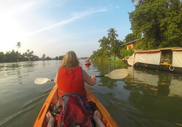 Tracey Billington canoeing on the waterway at Alappuzha, Kerala, India