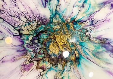 A bloom featuring sparkly pigments in blues. lavender, black. & gold, with a high gloss resin finish