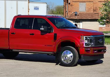 a red ford truck parked in lot after being detailed ceramic coating