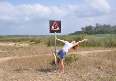 Tracey Billington showing off at estuary beach, St Lucia, South Africa