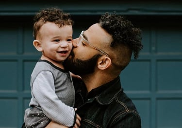 a man with a beard and glasses on his face and happy to show personal loans