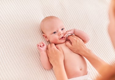 a baby is being held by a woman