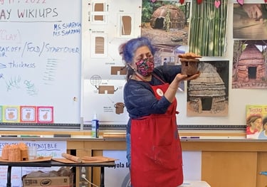 docent teaching a clay lesson