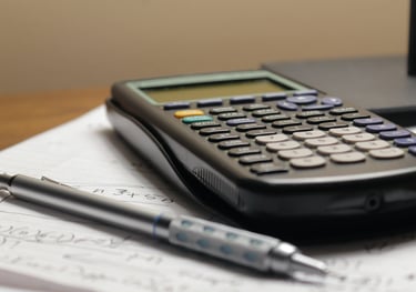 calculator, pen and notepad