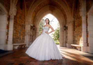 quinceanera in a white dress standing in a archway
