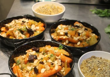 a table with bowls of mediterranean