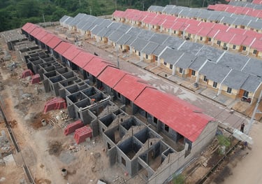 a building with a red roof and a black roof  Distributor Pralon