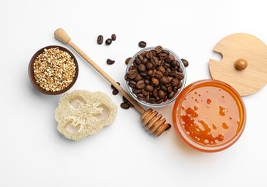 Natural skincare ingredients including coffee beans, honey, and grains – DIY exfoliating concept