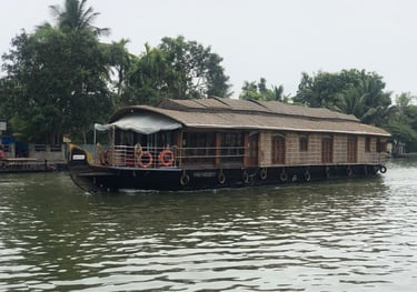Tracey Billington canoeing on the waterway at Alappuzha, Kerala, India
