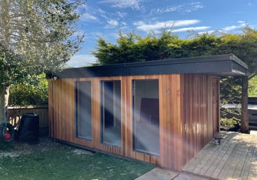 A modern garden studio clad in cedar wood