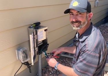 technician fixing a transformer in Peyton Colorado