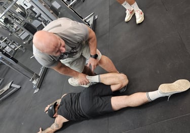 Partner-assisted stretching for mobility in guided end-range work to improve hips an