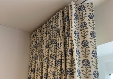 curtain with stitched single pleats hanging on a ceiling track