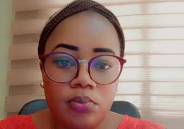 a woman with glasses and a red shirt