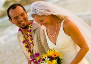 Beach Destination Wedding. Bride and Groom Photo Shoot. Smiling and walking on the beach. San Jose del Cabo, Mexico.