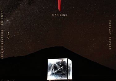 a man in a cube playing a grand piano in front of a mountain