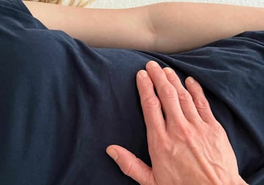 a woman with her hands on her stomach