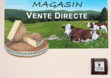 Enseigne peinte du magasin d'une fromagerie à Orgelet (39), Comté, vaches et paysage jurassien.