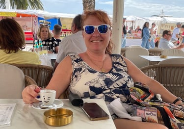 Picture of Teva in Split, Croatia, relaxing with a cup of espresso waiting for clients