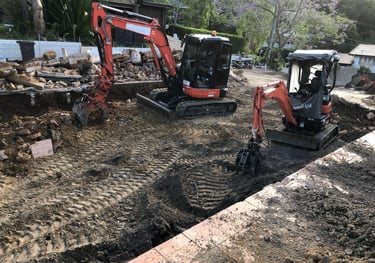 Removal of concrete strip footings.