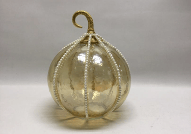 a glass Pumpkin ornament with pearls for Halloween festival 