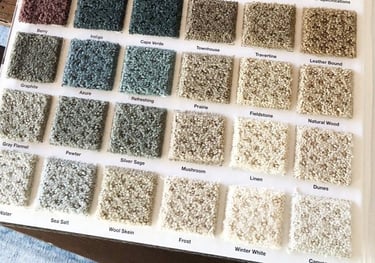 a book opened to show a selection of carpeting