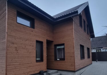 a house with a brick wall and a brick wall