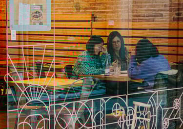 Customers enjoying the cosy interior of Santa Lola Santa Coloma